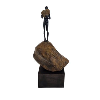 Bronze Figure On Rock High